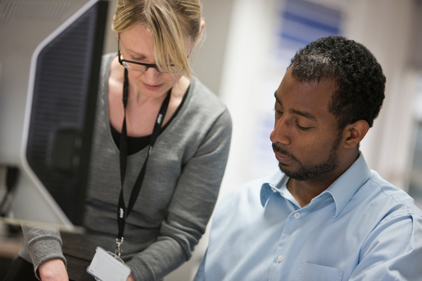 A female and male looking over a document