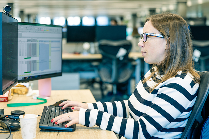 A female employee working at a computer