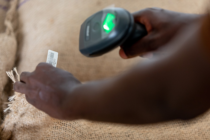 A bar code tag getting scanned by a handheld scanner