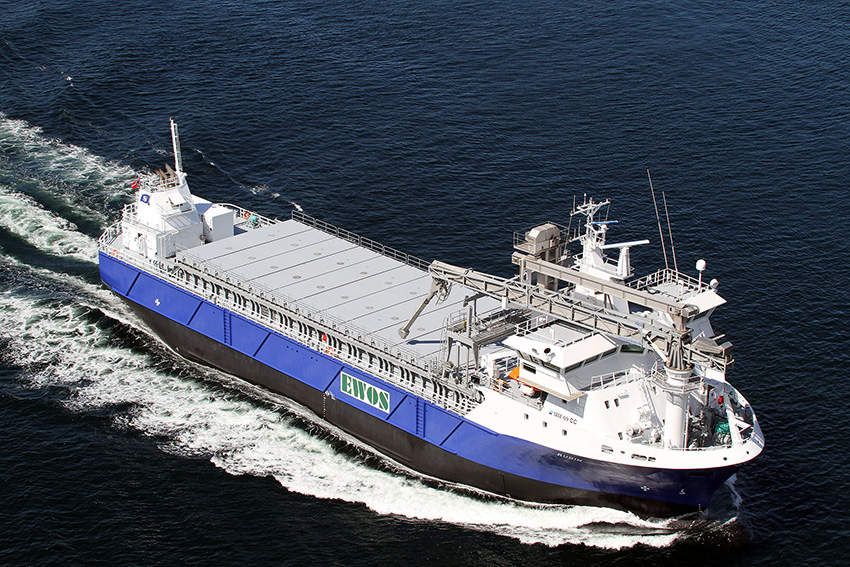 A cargo ship sailing across the ocean
